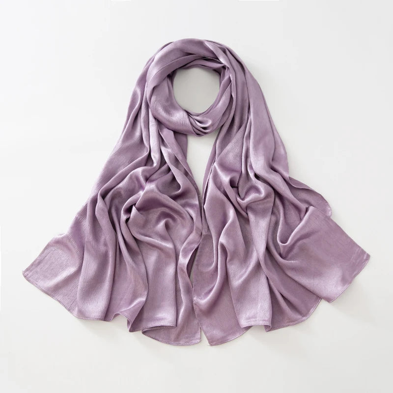 Women’s Solid Color Silk Satin Hijab Scarf – Smooth, Wrinkle-Textured Long Shawl

Crafted from luxurious silk-like satin, this hijab scarf features subtle bark-like wrinkles on one side and a smooth finish on the other. Its solid color design offers versa