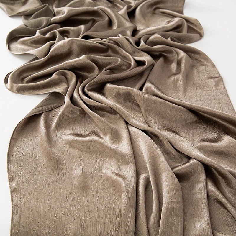 Women’s Solid Color Silk Satin Hijab Scarf – Smooth, Wrinkle-Textured Long Shawl

Crafted from luxurious silk-like satin, this hijab scarf features subtle bark-like wrinkles on one side and a smooth finish on the other. Its solid color design offers versa