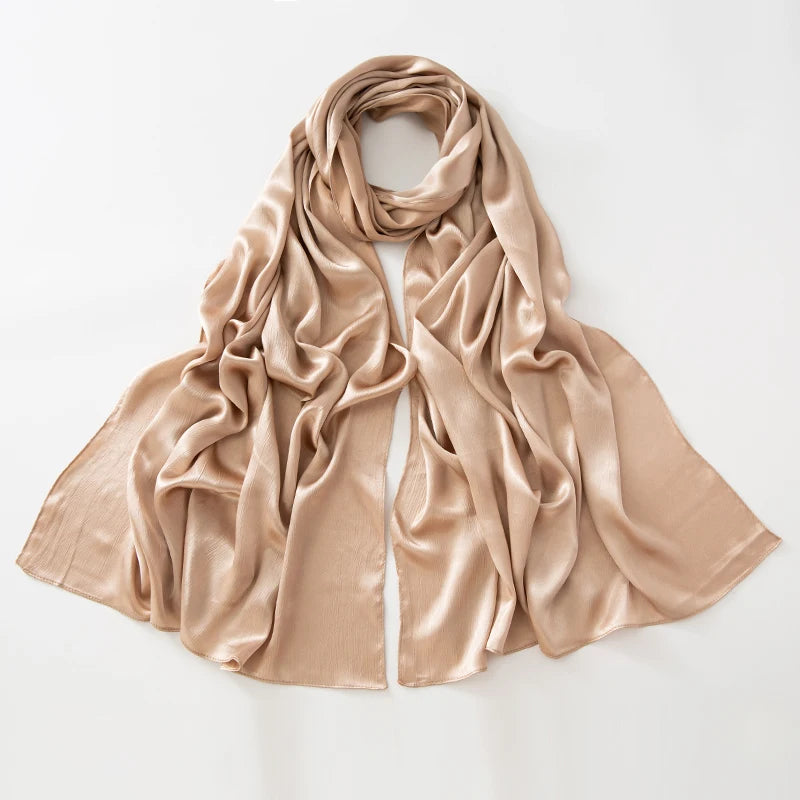 Women’s Solid Color Silk Satin Hijab Scarf – Smooth, Wrinkle-Textured Long Shawl

Crafted from luxurious silk-like satin, this hijab scarf features subtle bark-like wrinkles on one side and a smooth finish on the other. Its solid color design offers versa