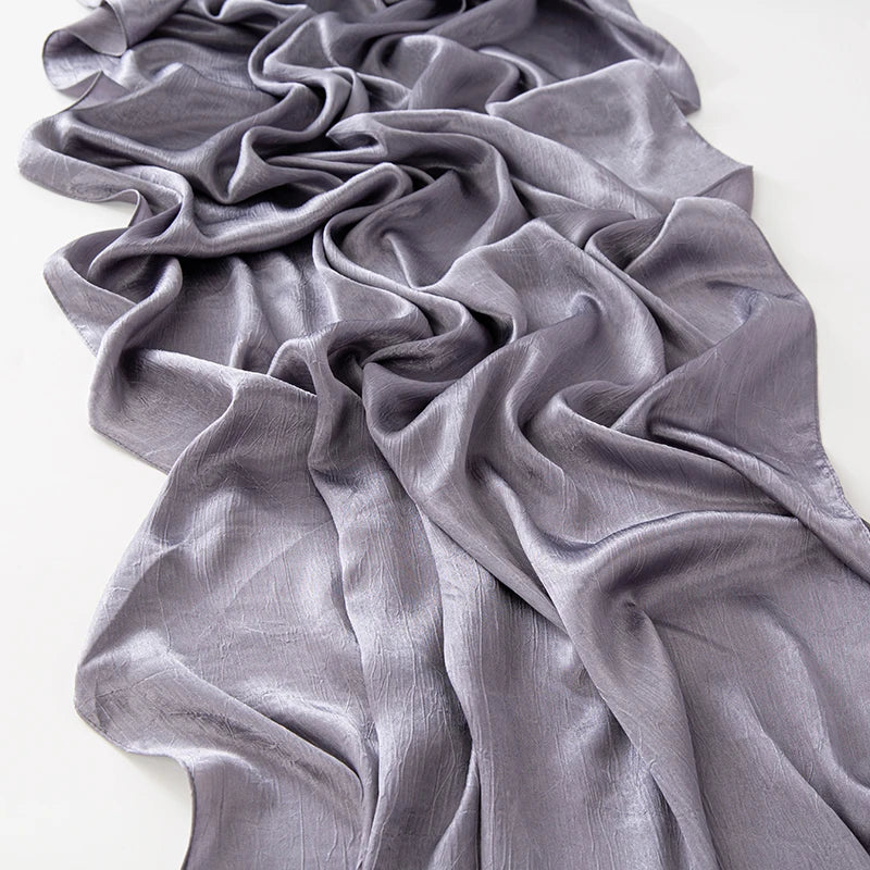 Women’s Solid Color Silk Satin Hijab Scarf – Smooth, Wrinkle-Textured Long Shawl

Crafted from luxurious silk-like satin, this hijab scarf features subtle bark-like wrinkles on one side and a smooth finish on the other. Its solid color design offers versa